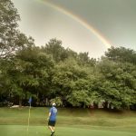 green grass with the flag in the hole.