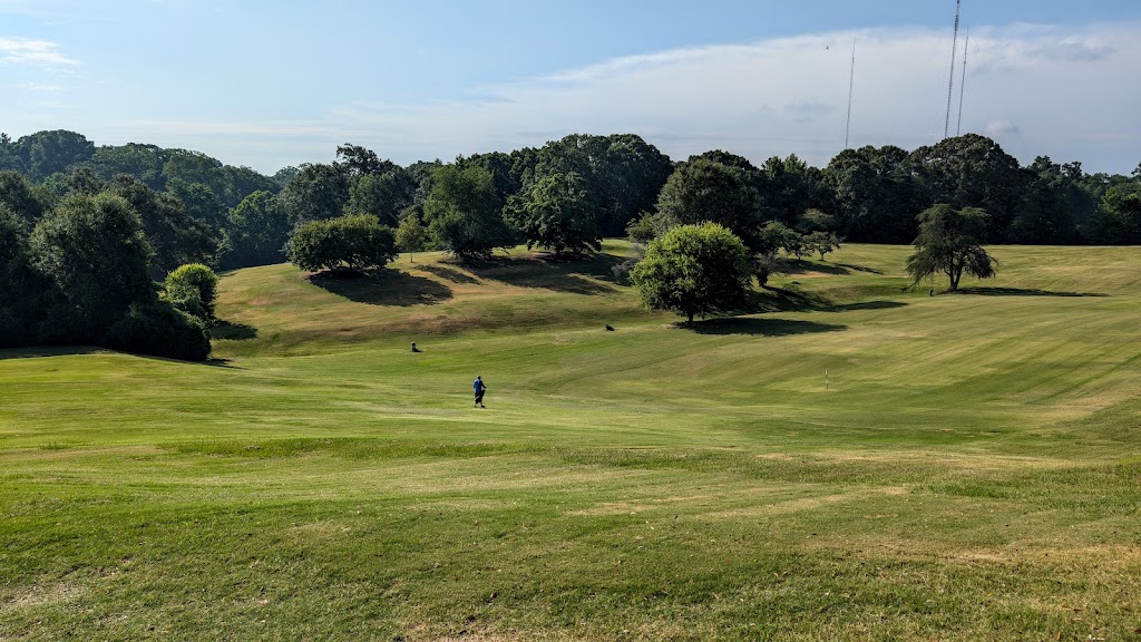 Panoramic view of a lush green golf course at Candler Park Golf Course. Smooth
