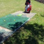 green grass with the flag in the hole.