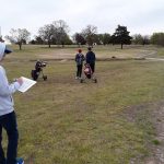 Panoramic view of a lush green golf course at Caney Golf Club. Smooth