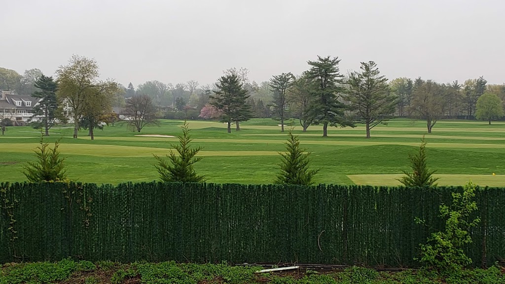 Panoramic view of a lush green golf course at Canoe Brook Golf Course. Smooth