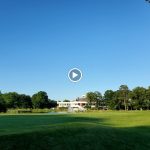 green grass with the flag in the hole.