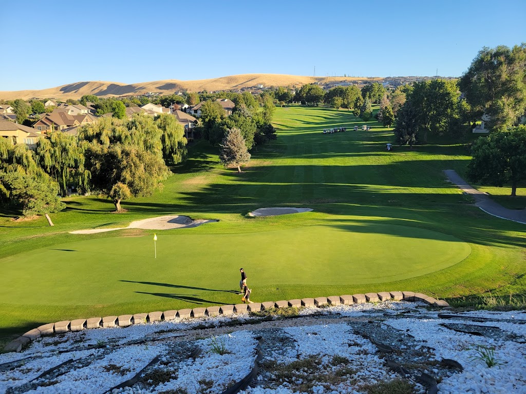 Panoramic view of a lush green golf course at Canyon Lakes Golf Course. Smooth