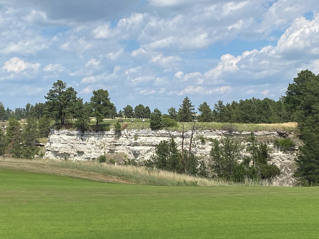 Panoramic view of a lush green golf course at CapRock Ranch. Smooth