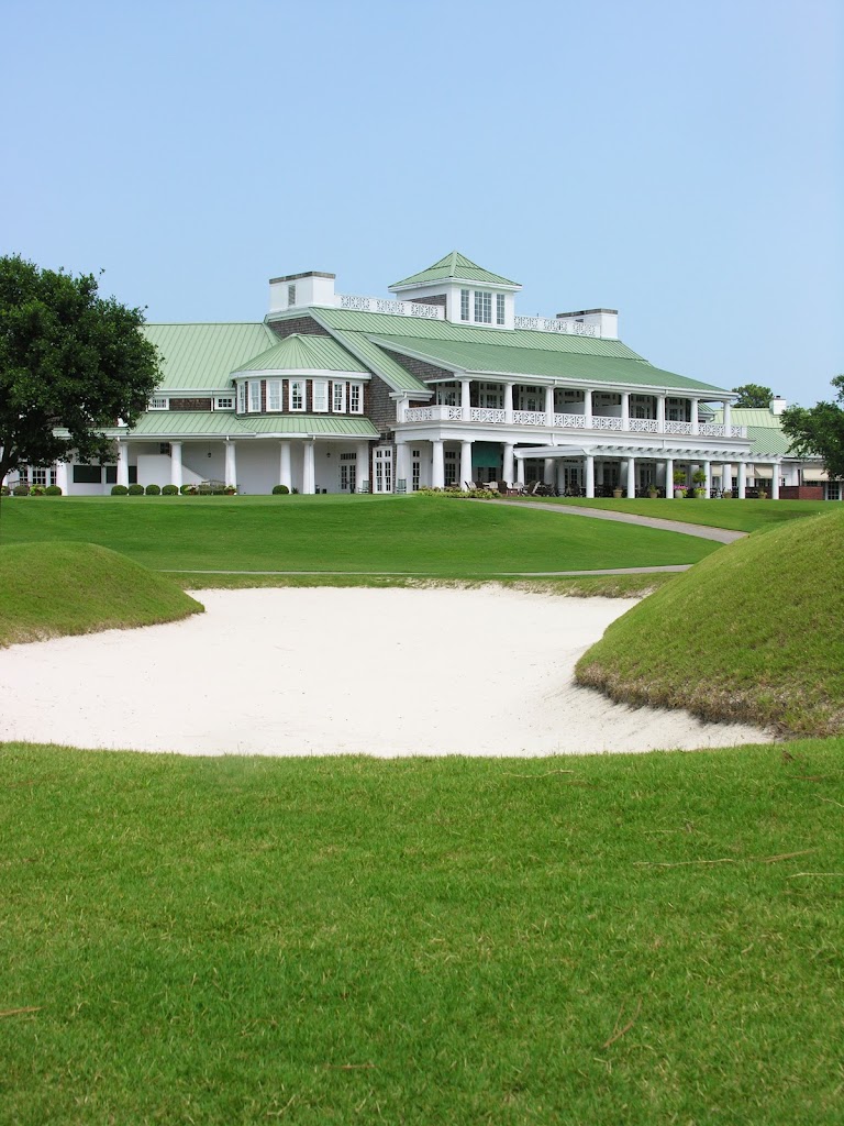 Panoramic view of a lush green golf course at Cape Fear Country Club. Smooth