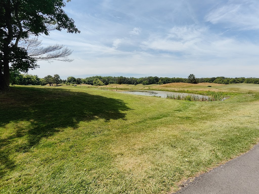 Panoramic view of a lush green golf course at Cape May National Golf Club. Smooth