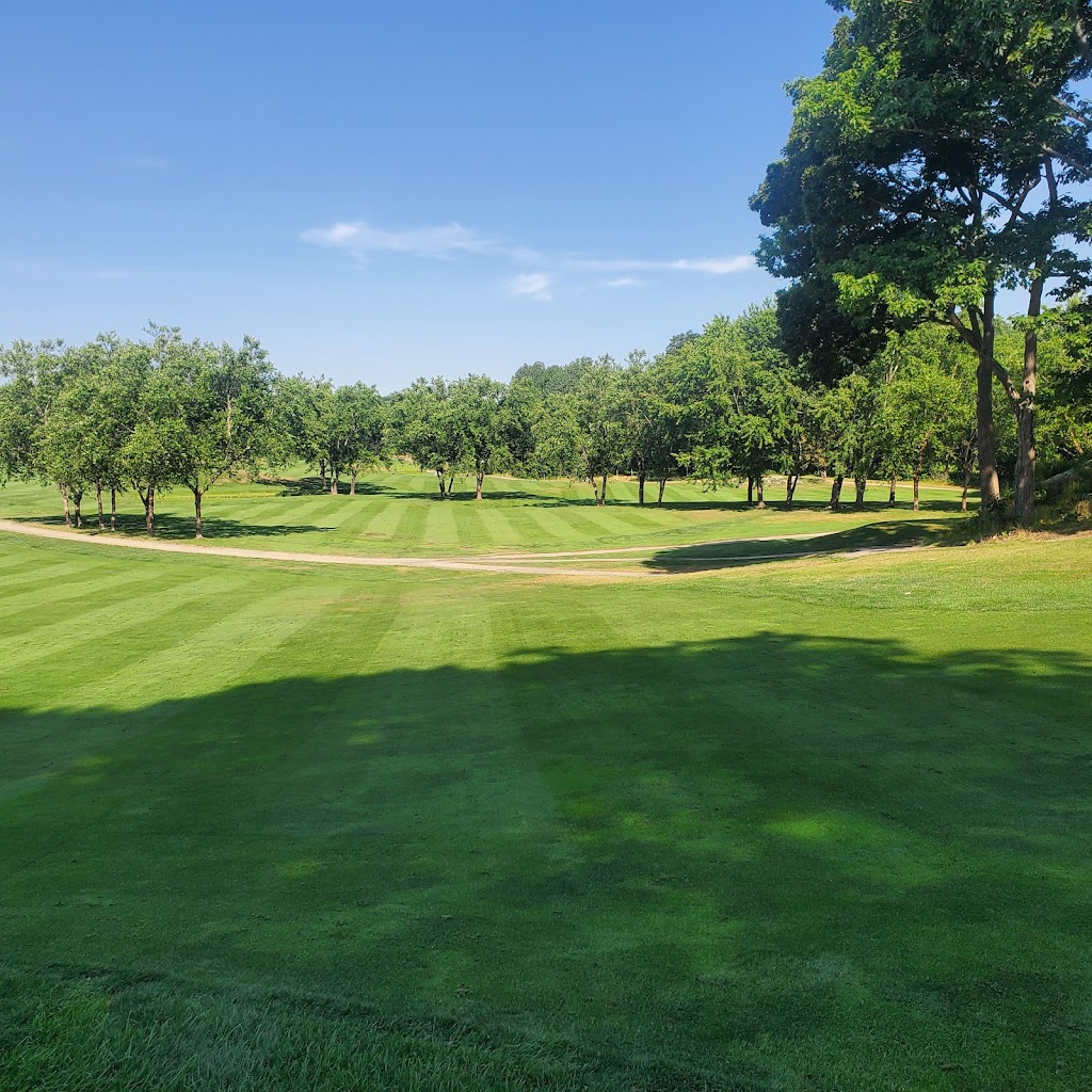 Panoramic view of a lush green golf course at Cape Neddick Country Club. Smooth
