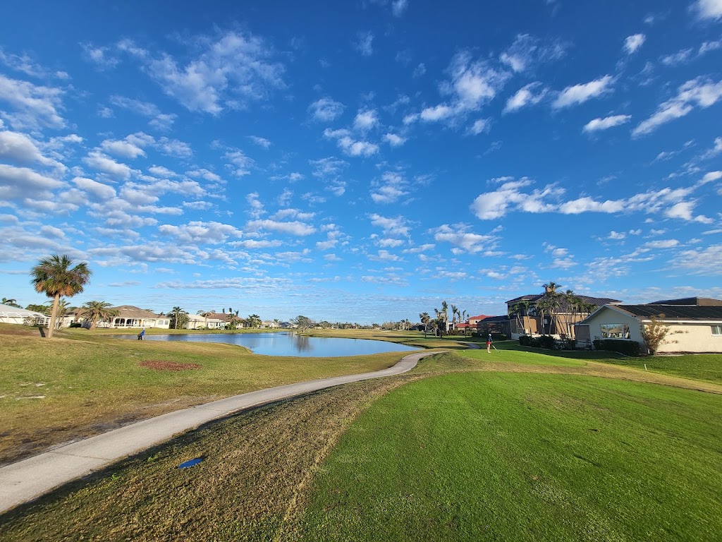 Panoramic view of a lush green golf course at Cape Royal Golf Club. Smooth