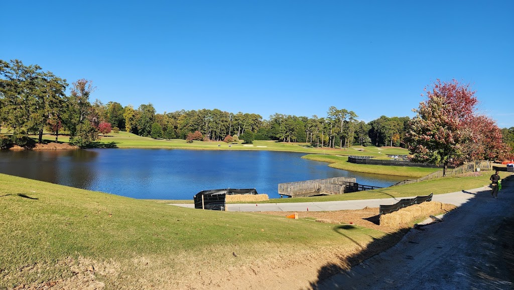 Panoramic view of a lush green golf course at Capital City Country Club. Smooth