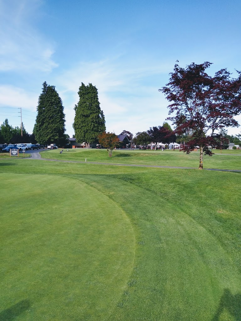 Panoramic view of a lush green golf course at Capitol City Golf Club. Smooth