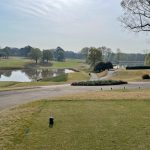 Panoramic view of a lush green golf course at Carolina Golf Club. Smooth