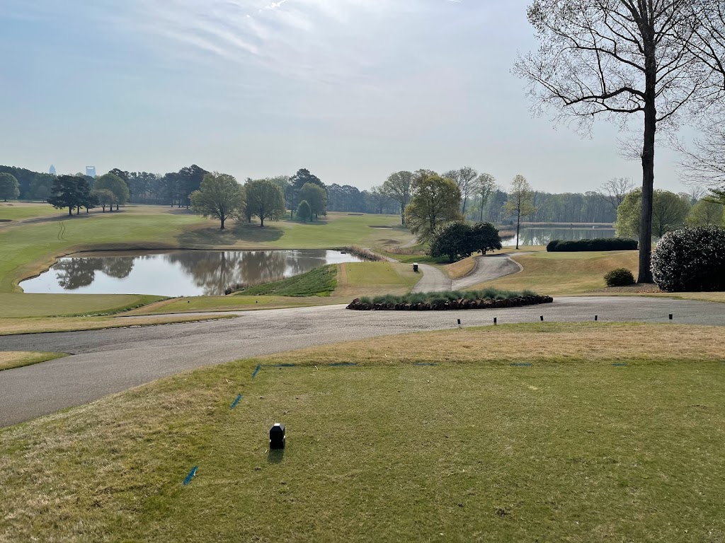 Panoramic view of a lush green golf course at Carolina Golf Club. Smooth