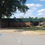 Panoramic view of a lush green golf course at Carolina Lakes Golf Course. Smooth