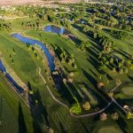 Panoramic view of a lush green golf course at Carroll Municipal Golf Course. Smooth