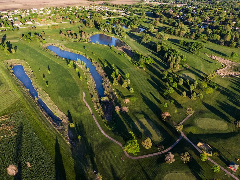Panoramic view of a lush green golf course at Carroll Municipal Golf Course. Smooth