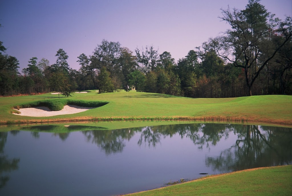 Panoramic view of a lush green golf course at Carter Plantation Golf Course. Smooth
