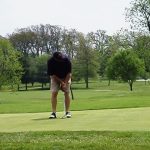 Panoramic view of a lush green golf course at Carthage Golf Course. Smooth
