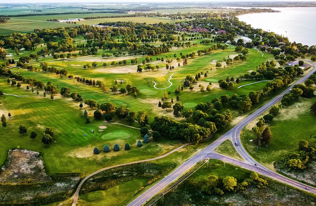 Panoramic view of a lush green golf course at Cattail Crossing Golf Course. Smooth