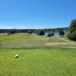 Panoramic view of a lush green golf course at Causeway Club. Smooth