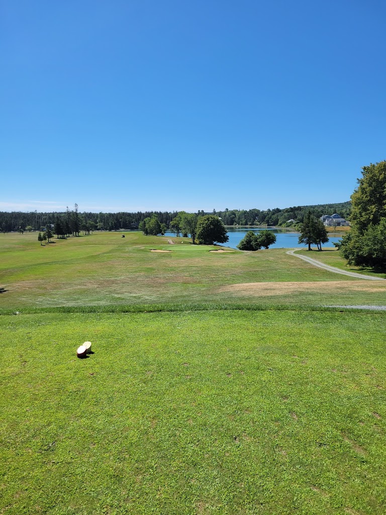 Panoramic view of a lush green golf course at Causeway Club. Smooth