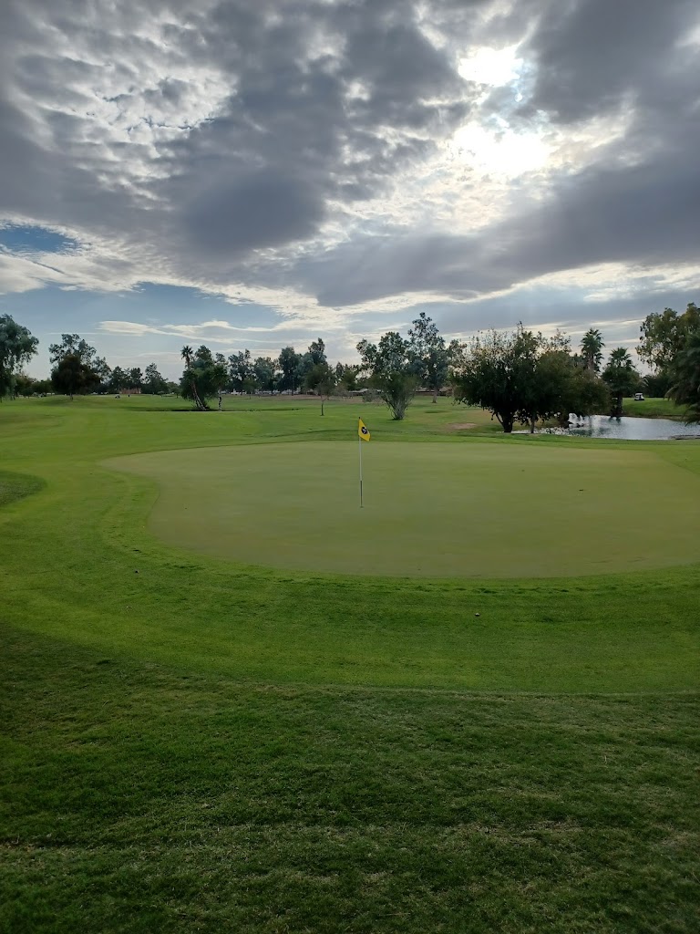 Panoramic view of a lush green golf course at Cave Creek Golf Course. Smooth