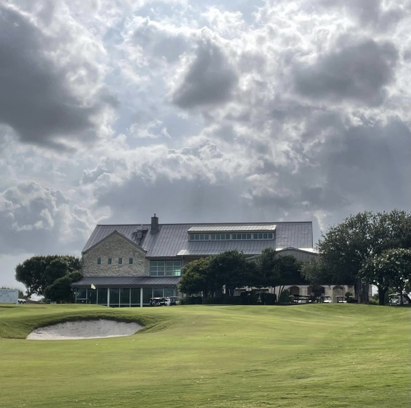 Panoramic view of a lush green golf course at Cedar Crest Golf Course. Smooth