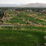 Panoramic view of a lush green golf course at Cedar Hills Golf Club. Smooth