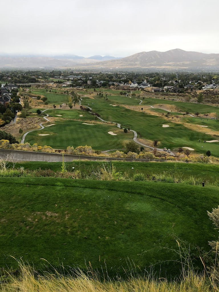 Panoramic view of a lush green golf course at Cedar Hills Golf Club. Smooth