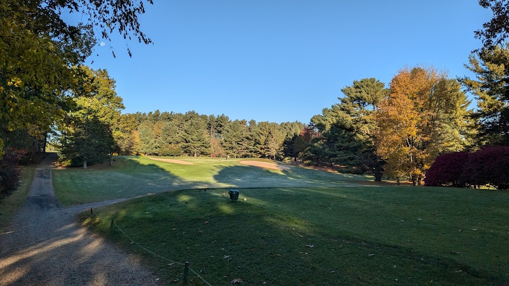 Panoramic view of a lush green golf course at Cedar Knob Golf Course. Smooth