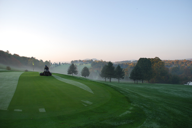 Panoramic view of a lush green golf course at Cedar Knoll Country Club. Smooth