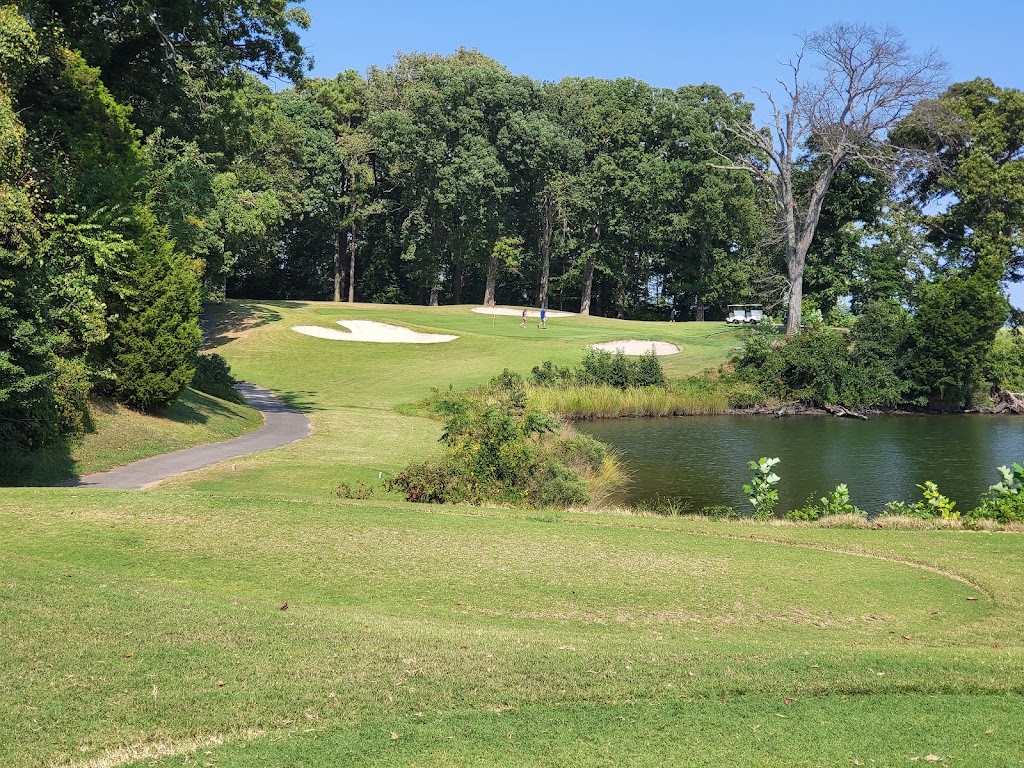 Panoramic view of a lush green golf course at Cedar Point Golf Club. Smooth