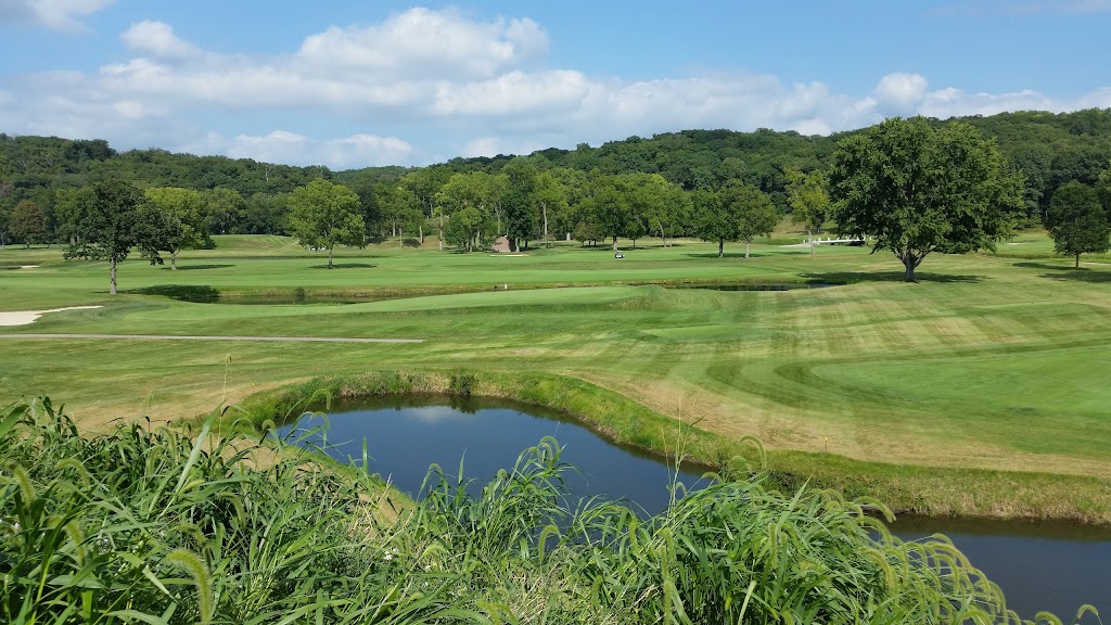 Panoramic view of a lush green golf course at Cedar Rapids Country Club. Smooth