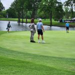 green grass with the flag in the hole.