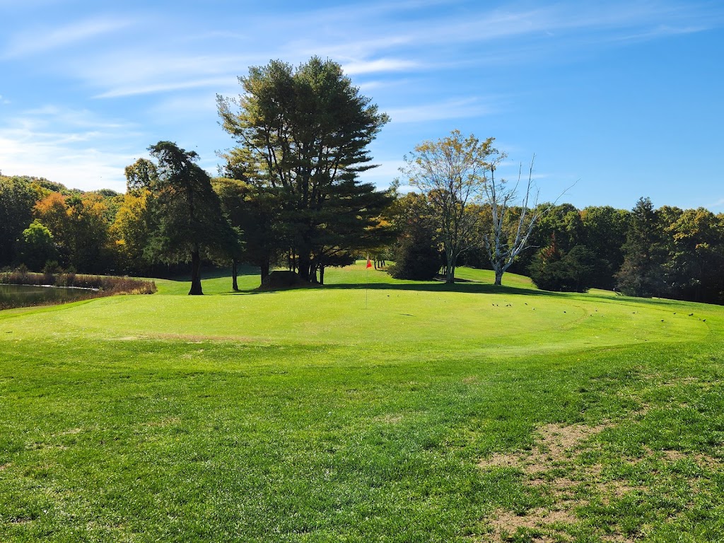 Panoramic view of a lush green golf course at Cedar Ridge Golf Course. Smooth