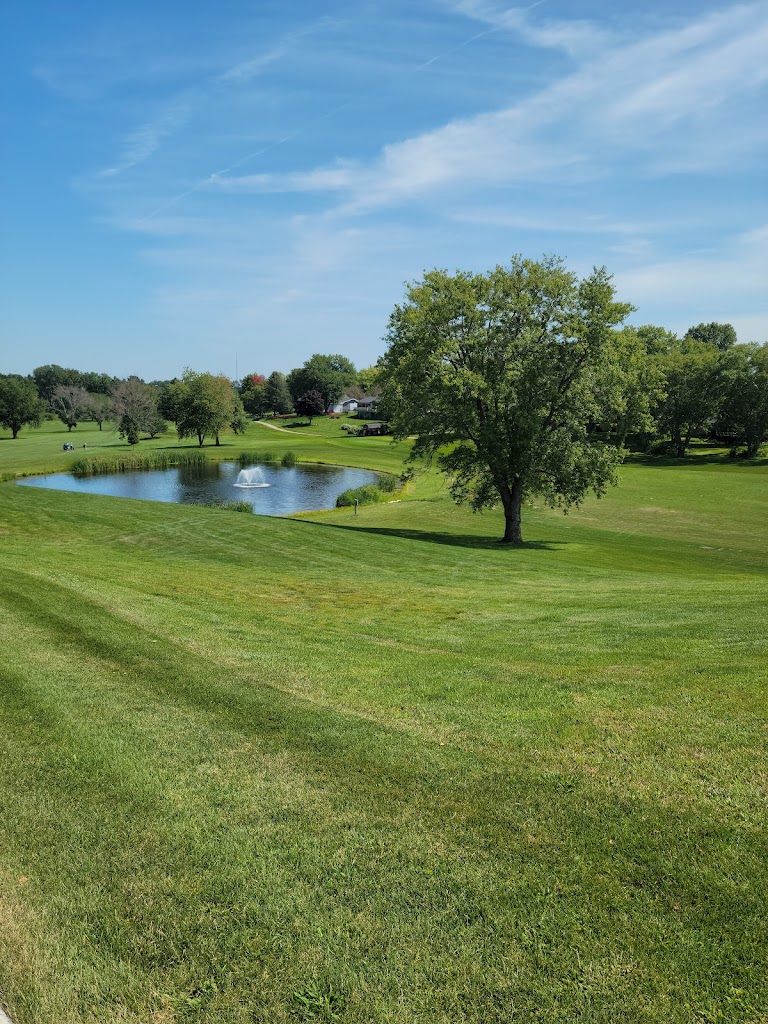 Panoramic view of a lush green golf course at Cedars Edge Golf Course. Smooth