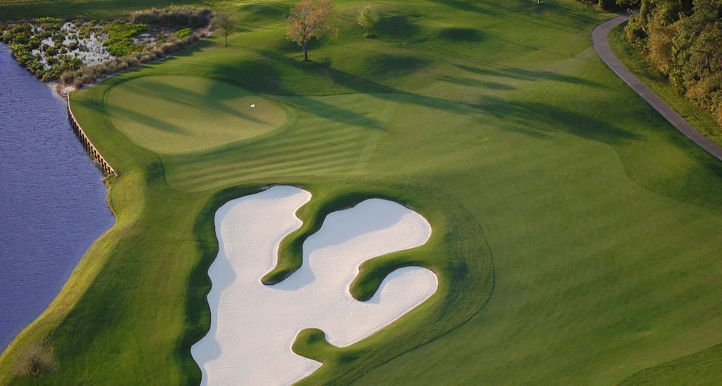 Panoramic view of a lush green golf course at Celebration Golf Club. Smooth