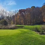 Panoramic view of a lush green golf course at Centennial Golf Club. Smooth