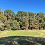 Panoramic view of a lush green golf course at Centennial Golf Course. Smooth