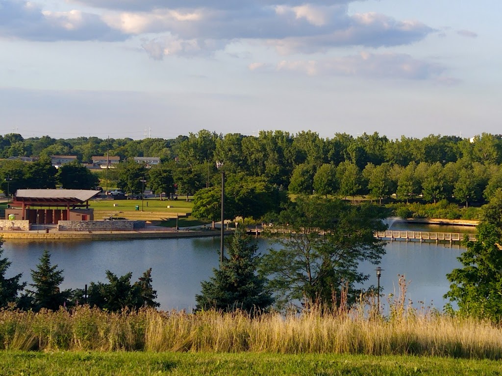 Panoramic view of a lush green golf course at Centennial Park Golf Course. Smooth
