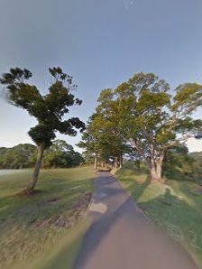 Panoramic view of a lush green golf course at Central Valley Golf Course. Smooth