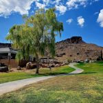 Panoramic view of a lush green golf course at Cerbat Cliffs Golf Course. Smooth
