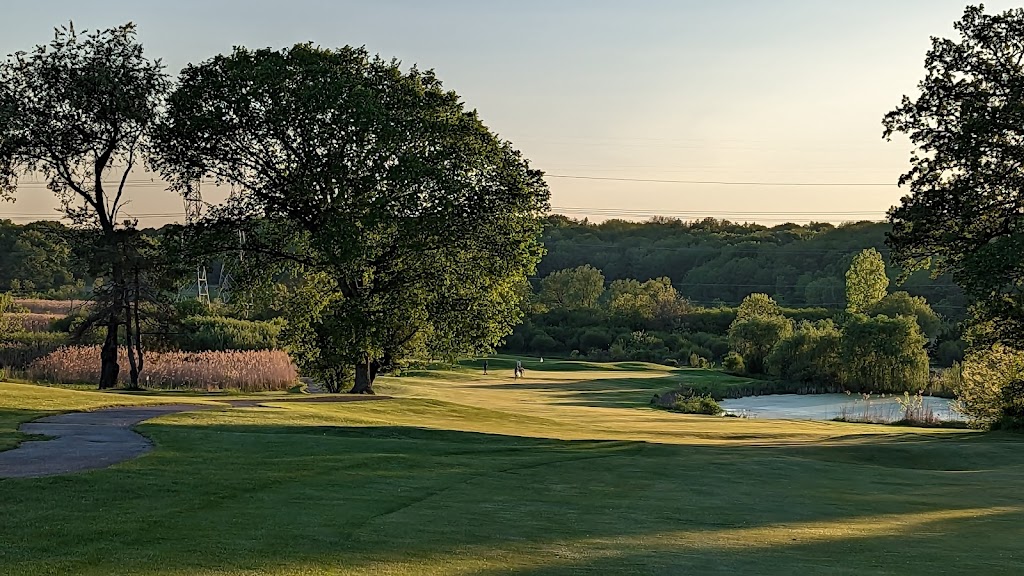 Panoramic view of a lush green golf course at Chalet Hills Golf Club. Smooth