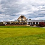 Panoramic view of a lush green golf course at Chantilly National Golf & Country Club. Smooth