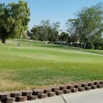 Panoramic view of a lush green golf course at Chaparral Golf & Country Club. Smooth