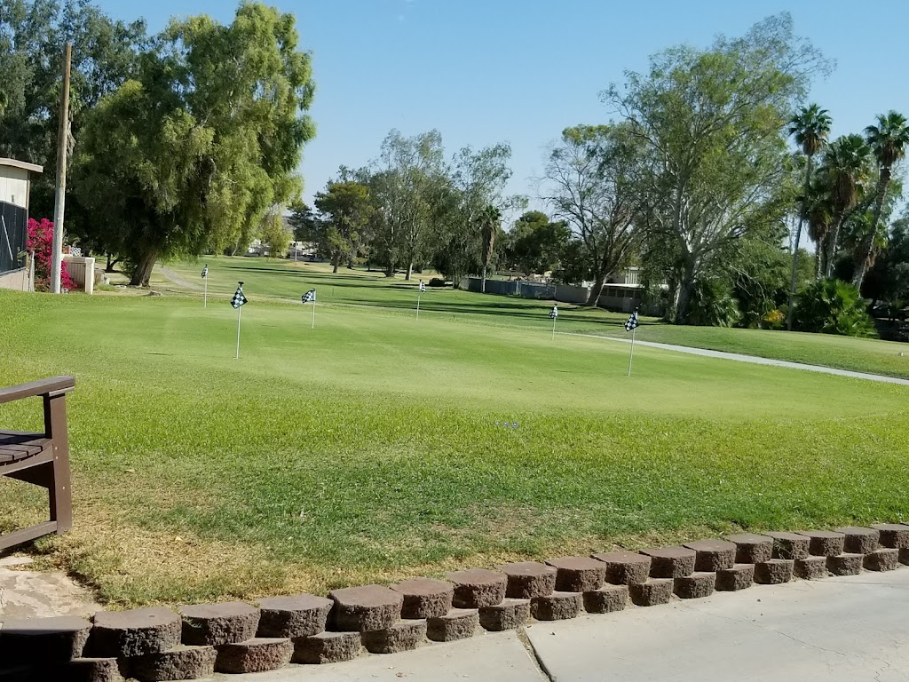 Panoramic view of a lush green golf course at Chaparral Golf & Country Club. Smooth