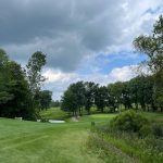 Panoramic view of a lush green golf course at Chapel Hill Golf Course. Smooth