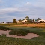 Panoramic view of a lush green golf course at Chariot Run Golf Club. Smooth