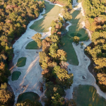 Panoramic view of a lush green golf course at Charwood Golf Club. Smooth