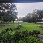 Panoramic view of a lush green golf course at Chechessee Creek Club. Smooth