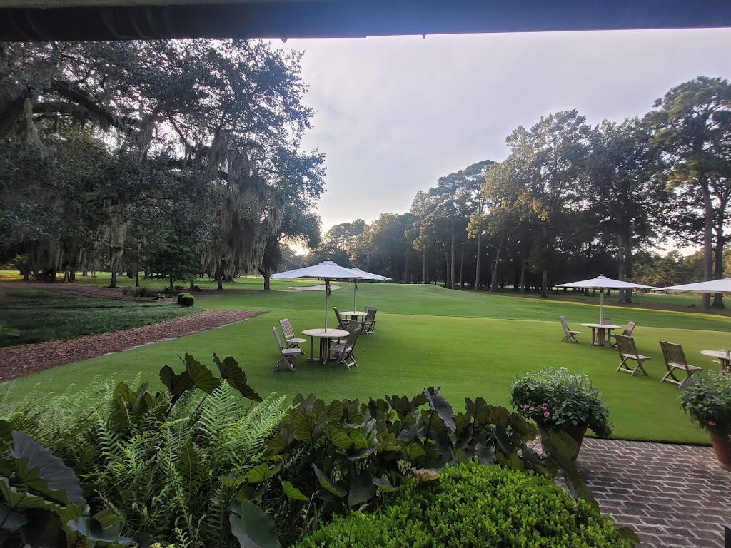 Panoramic view of a lush green golf course at Chechessee Creek Club. Smooth